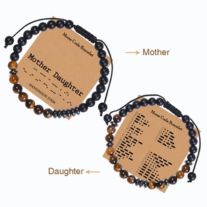 Detail of Morse code bracelet set with tiger eye, onyx beads and explanation card