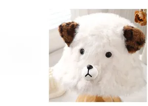 Close-up of white plush bucket hat featuring leopard ears and cute animal face detail
