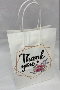 Detail of white paper gift bag featuring floral Thank You print and white paper handles