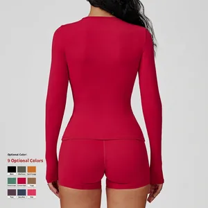 Slim fit long sleeve yoga top and high waist shorts set in vibrant red with thumb holes