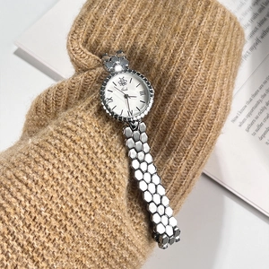 Elegant silver honeycomb bracelet watch with white Roman dial on knitted sleeve