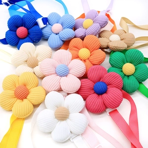 Colorful corduroy flower pet bows with adjustable plastic clips for dog grooming