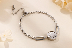 Detailed close-up of a silver elephant pendant bracelet with adjustable chain link