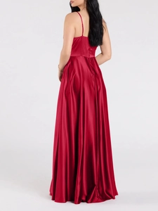 Elegant red silk evening gown with thin straps and a luxurious backless floor-length design