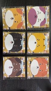 Detailed set of six colorful silicone dog coasters in individual retail packaging