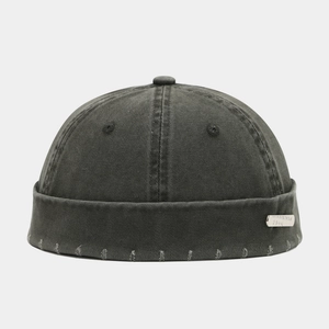 Washed dark gray docker hat with vintage distressed texture and metal plate detail