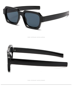 Detail showing high-quality metal hinges and structure of black square oversized sunglasses