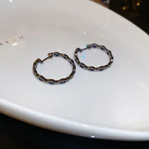 Retro geometric hollow hoop earrings with navy zircon stones in gunmetal finish