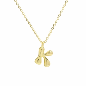 Detailed close-up of shiny 18k gold plated letter K bubble pendant necklace on a thin chain