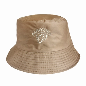 Detailed close-up of khaki cotton bucket hat featuring white embroidered text and floral logo