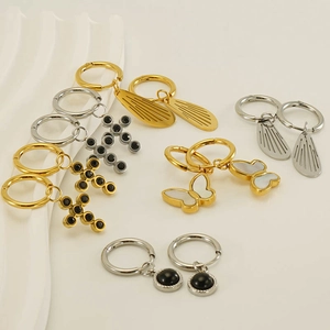 Set of stainless steel hoop earrings with wing, cross, and butterfly charms