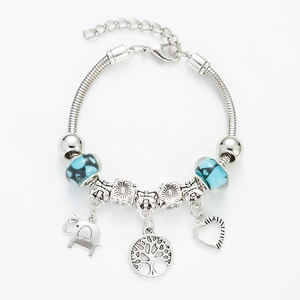 Detail of silver tree of life bracelet with blue glass beads and elephant heart charms