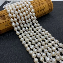 Macro shot of 5-6mm white freshwater pearls with natural luster on a bamboo scroll