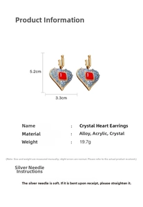 Macro view of vintage heart earrings with red crystal and blue enamel details