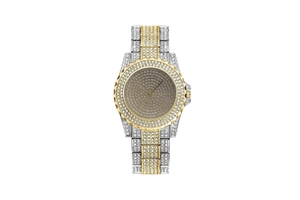 Detailed macro of crystal-encrusted gold and silver tone luxury women's watch