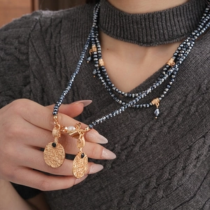 Vintage multi-strand beaded necklace with gold embossed coin pendants for women