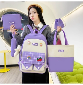Five-piece purple and beige canvas backpack set including tote, crossbody, and pencil case