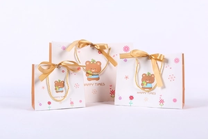 Three sizes of cartoon bear gift bags with golden ribbons and happy times printing