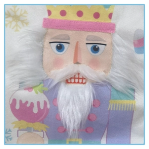 Detailed close-up of a festive Christmas nutcracker pattern on soft fabric with plush details