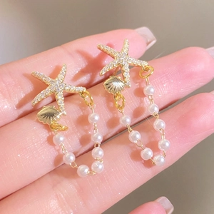 Starfish and shell drop earrings with pearls and crystals in gold finish