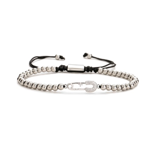 Adjustable silver beaded bracelet with cubic zirconia safety pin heart charm and black cord