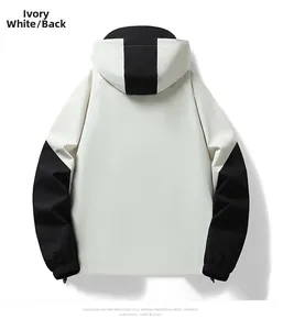 Rear view of ivory and black contrast panel outdoor softshell jacket with hood