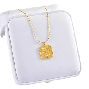 Gold sunflower square pendant necklace in a white gift box with round bead chain link
