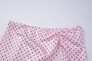Detailed view of pink polka dot bikini skirt with adjustable drawstring waistband