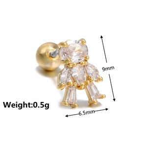 Macro detail of golden bear ear stud with pavé cubic zirconia and screw ball back