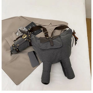 Detailed top view of a horse-shaped canvas shoulder bag with premium leather straps