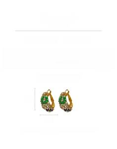Detail view of vintage glass C-shaped earrings with green beads and pearl accents