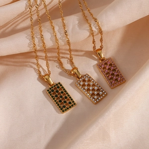 Gold plated rectangle hollow necklaces with green white and pink gemstones on satin