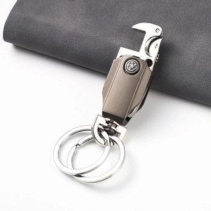 Detail of titanium gray metal keychain with built-in bottle opener and dual rings