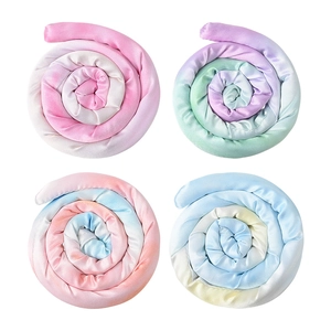 Set of four colorful bendable heatless hair curlers in gradient satin fabric on white background