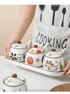 Hand-painted floral ceramic seasoning jar set with three jars, spoons, and wood lid tray
