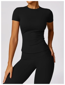 Close-up of black quick-dry compression top and high-waisted yoga pants for women