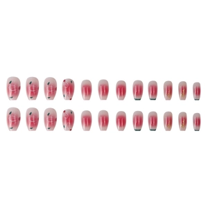 Pink gradient press-on nails with cherry blossom patterns and gold foil accents