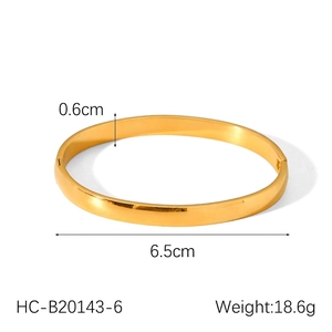 Polished gold-plated stainless steel bangle with 0.6cm width and 6.5cm inner diameter