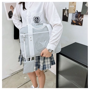 Detailed view of grey JK travel bag featuring a transparent heart window and small pouch