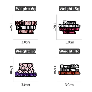 Detail showing colorful quote enamel pins with size and weight measurements on white background