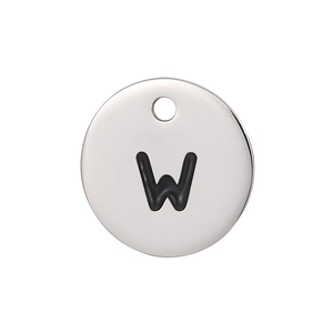 Detailed macro view of a silver titanium steel pendant featuring a black enamel letter W