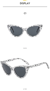 Front and 45-degree side views of cat eye sunglasses with black and white grid patterns