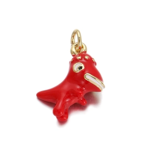 Macro shot of a red enamel dinosaur charm with 18k gold plating for DIY jewelry