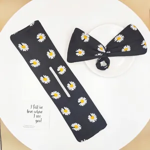 Black floral bow hair clip set with white daisy prints for bun hairstyles styling