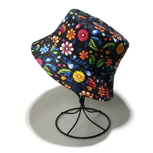 Summer sun hat with vibrant floral patterns on black fabric for beach travel wear