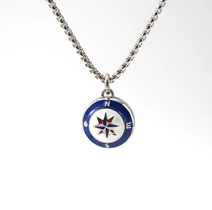 Close-up of nautical compass pendant with blue enamel and stainless steel chain