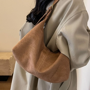 Brown vintage matte suede tote bag shown on model for elegant casual autumn look