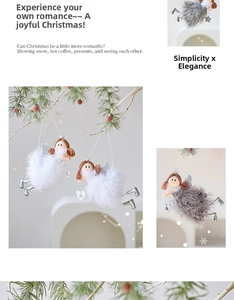 Close-up of cute plush angel ornaments with feather skirts hanging on a Christmas tree