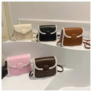 Close-up of small crossbody bags in five colors with plush faux fur trim and leather finish