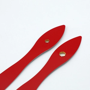 Leaf-shaped red metal clock hands set with golden center mounting holes on white background